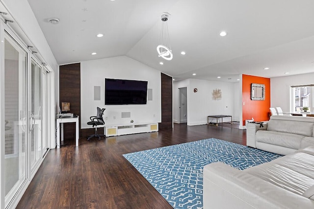 living area with baseboards, vaulted ceiling, wood finished floors, and recessed lighting
