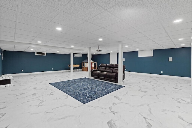 interior space featuring recessed lighting, marble finish floor, and baseboards