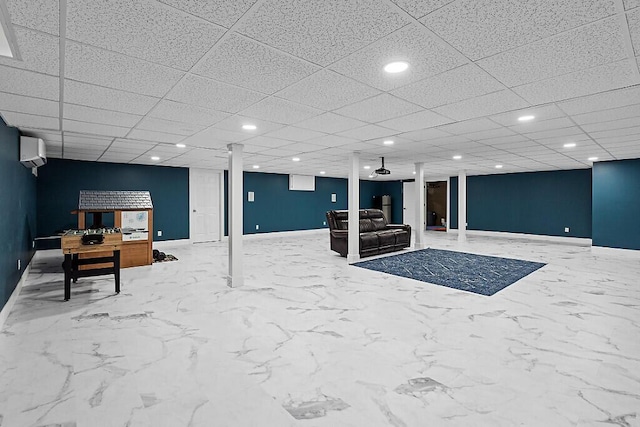 finished below grade area with recessed lighting, a wall mounted AC, and baseboards