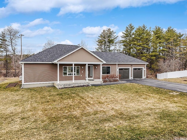 craftsman-style home featuring a porch, a front lawn, driveway, and a garage