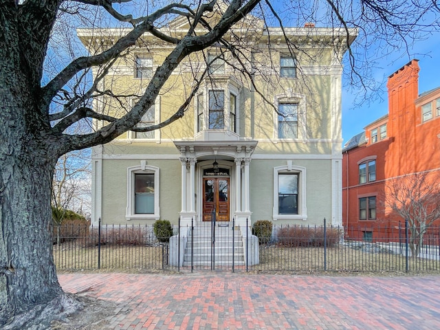 727 Congress St Unit 5, Portland, ME 04102 - italianate home with french doors, stucco siding, and a fenced front yard