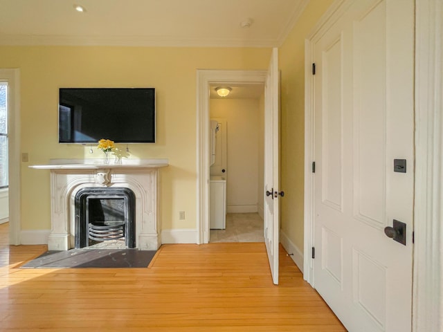 727 Congress St Unit 5, Portland, ME 04102 - unfurnished living room featuring a fireplace, baseboards, ornamental molding, and wood finished floors