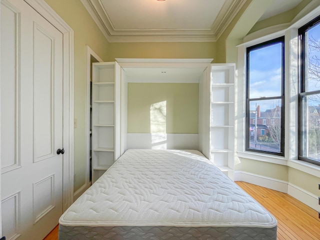 727 Congress St Unit 5, Portland, ME 04102 - bedroom featuring baseboards, wood finished floors, and ornamental molding