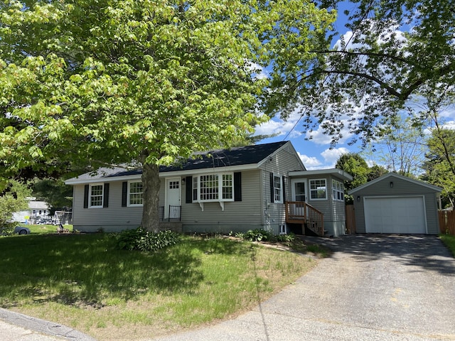 31 Amherst St, Auburn, ME 04210 - single story home featuring an outdoor structure, a garage, driveway, and a front lawn
