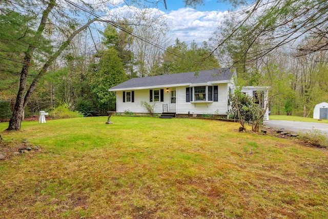 927 Pleasant St, Blue Hill, ME 04614 - ranch-style house with a front yard and a storage shed