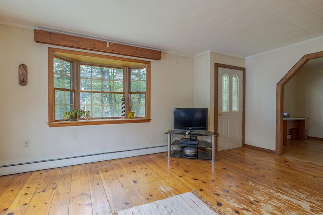 927 Pleasant St, Blue Hill, ME 04614 - living room featuring crown molding, wood-type flooring, baseboard heating, and baseboards