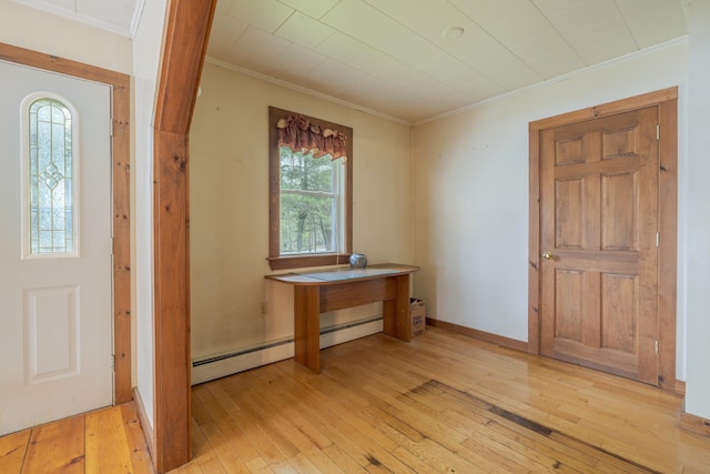 927 Pleasant St, Blue Hill, ME 04614 - entryway featuring ornamental molding, light wood finished floors, and a baseboard radiator