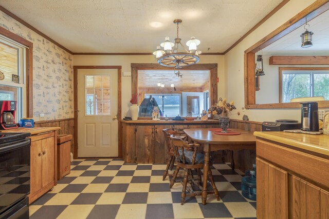 927 Pleasant St, Blue Hill, ME 04614 - dining area featuring light floors, wainscoting, a chandelier, and ornamental molding