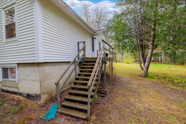 927 Pleasant St, Blue Hill, ME 04614 - view of property exterior featuring stairway and a lawn