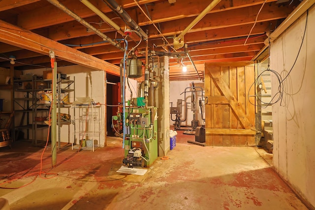 927 Pleasant St, Blue Hill, ME 04614 - unfinished below grade area with a heating unit
