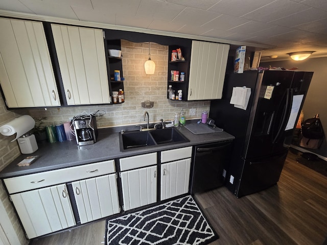 kitchen with black appliances, a sink, open shelves, and dark countertops
