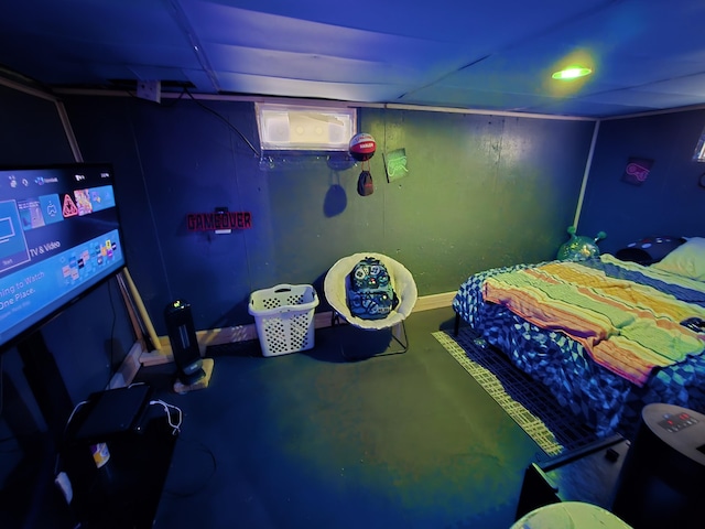 bedroom featuring concrete floors