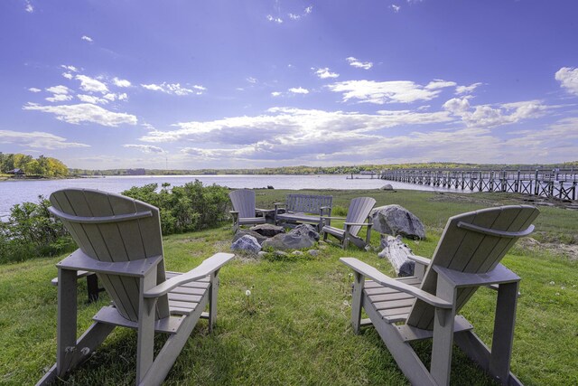 302 Eddy Rd Unit 302, Edgecomb, ME 04556 - view of green lawn featuring a water view and an outdoor fire pit
