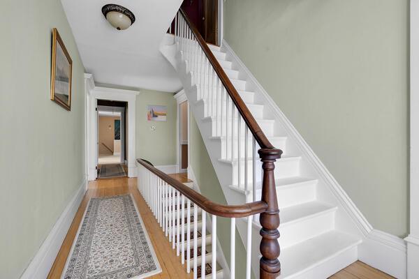 staircase featuring wood finished floors