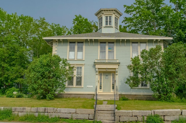 italianate-style house with a front lawn