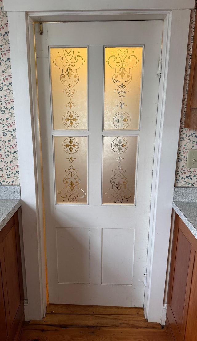 doorway to outside featuring wood finished floors