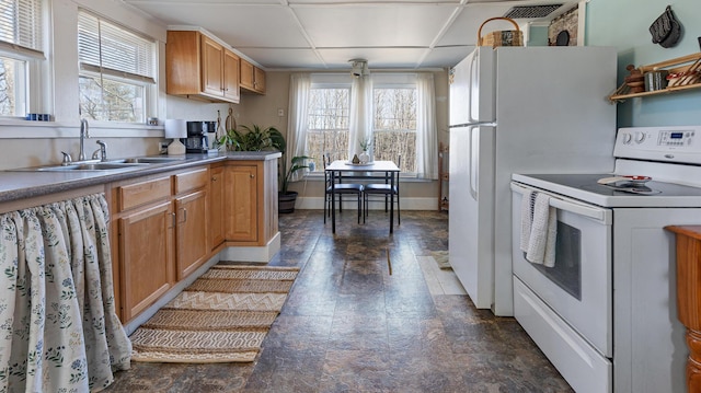 4 Burgess Rd, Guilford, ME 04443 - kitchen featuring baseboards, white electric range, stone finish flooring, and a sink