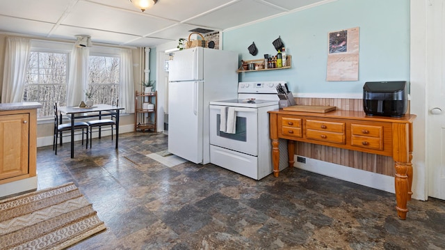 4 Burgess Rd, Guilford, ME 04443 - kitchen featuring stone finish floor, baseboards, and white appliances