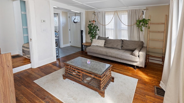 4 Burgess Rd, Guilford, ME 04443 - living area with wood finished floors, baseboards, and visible vents