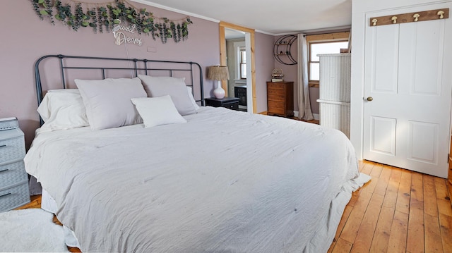 4 Burgess Rd, Guilford, ME 04443 - bedroom with light wood-style flooring and ornamental molding