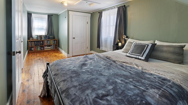 4 Burgess Rd, Guilford, ME 04443 - bedroom with hardwood / wood-style flooring, baseboards, and crown molding