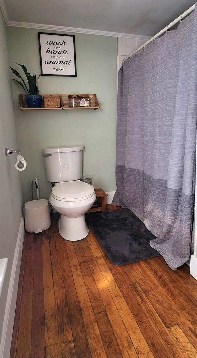4 Burgess Rd, Guilford, ME 04443 - full bath with hardwood / wood-style floors, toilet, curtained shower, and crown molding