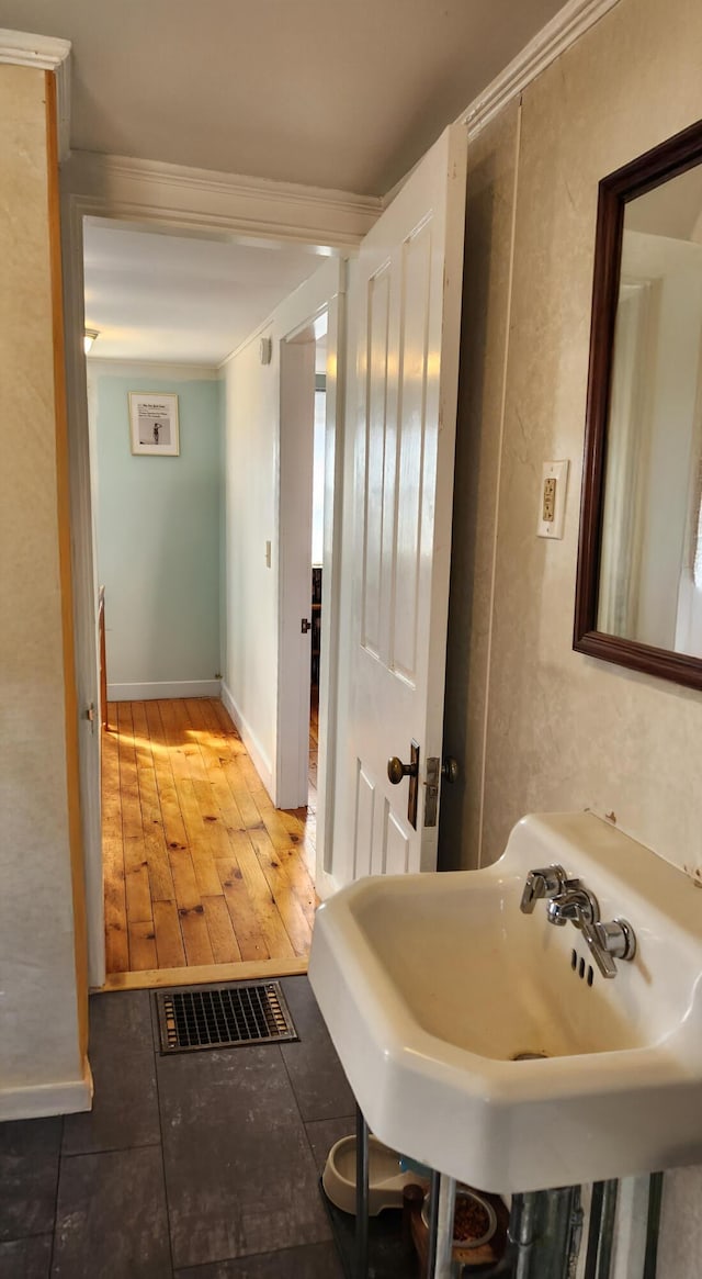 4 Burgess Rd, Guilford, ME 04443 - bathroom featuring a sink, baseboards, visible vents, and tile patterned flooring