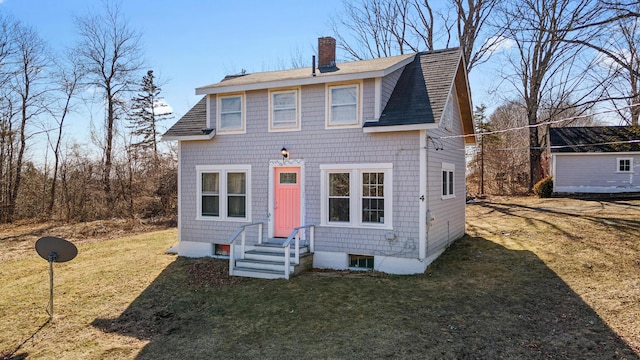 4 Burgess Rd, Guilford, ME 04443 - view of front of home featuring a front yard, roof with shingles, and a chimney
