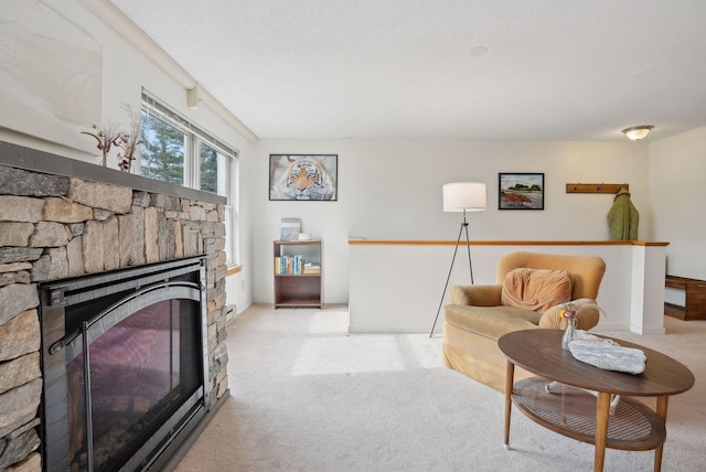51 Woodland Rd Unit 1, Cape Elizabeth, ME 04107 - living room featuring carpet and a stone fireplace