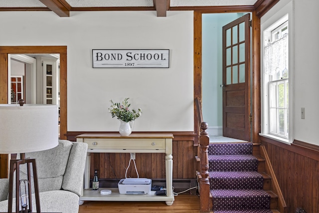 294 E Pond Rd, Jefferson, ME 04348 - entrance foyer featuring beam ceiling, a wainscoted wall, and stairway