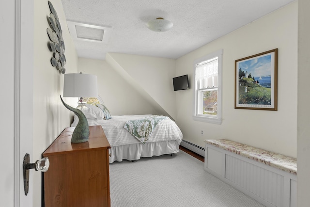 294 E Pond Rd, Jefferson, ME 04348 - carpeted bedroom featuring a baseboard radiator, a textured ceiling, and attic access