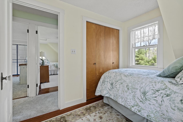 294 E Pond Rd, Jefferson, ME 04348 - bedroom featuring a closet, baseboards, and a textured ceiling