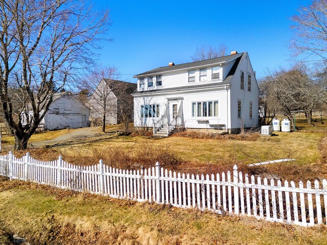 795 Bremen Rd, Waldoboro, ME 04572 - traditional home with a chimney, fence, and a front yard