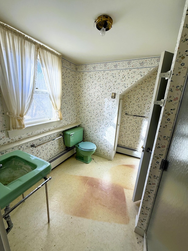 795 Bremen Rd, Waldoboro, ME 04572 - bathroom with toilet, wallpapered walls, and a baseboard radiator