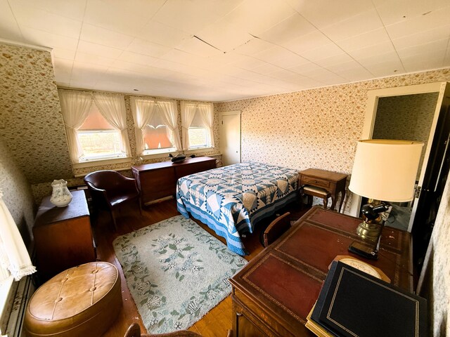 795 Bremen Rd, Waldoboro, ME 04572 - bedroom with wallpapered walls and wood finished floors