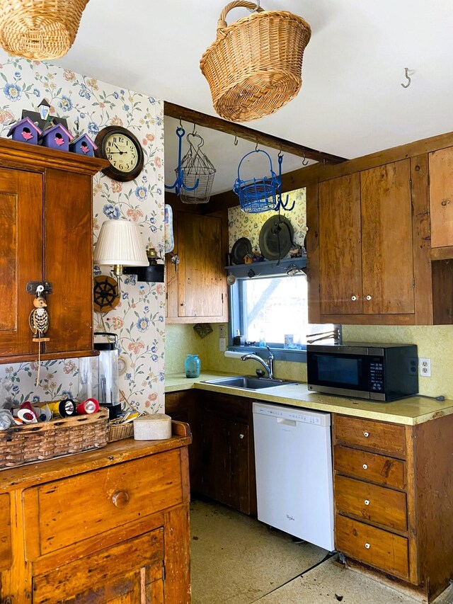 795 Bremen Rd, Waldoboro, ME 04572 - kitchen with stainless steel microwave, a sink, white dishwasher, and backsplash