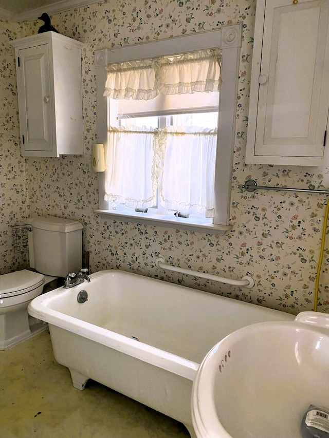 795 Bremen Rd, Waldoboro, ME 04572 - full bathroom featuring a freestanding tub, wallpapered walls, and toilet