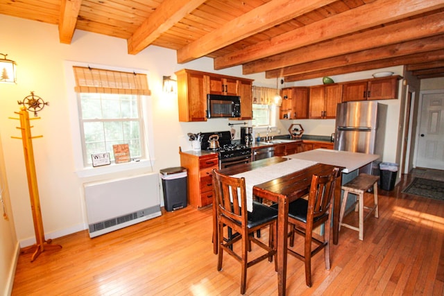 4 Bobs Way, Bethel, ME 04217 - kitchen featuring stainless steel appliances, brown cabinetry, a sink, light wood-style flooring, and beamed ceiling