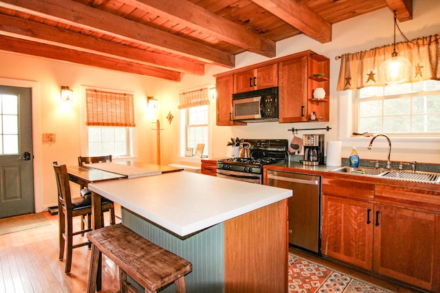 4 Bobs Way, Bethel, ME 04217 - kitchen featuring gas range oven, dishwasher, a sink, wooden ceiling, and a breakfast bar