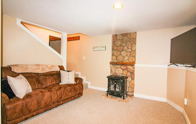 4 Bobs Way, Bethel, ME 04217 - carpeted living area featuring baseboards, stairs, and a wood stove