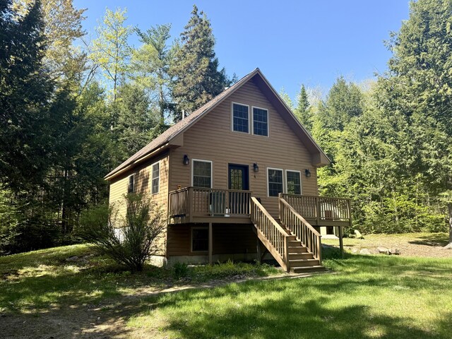4 Bobs Way, Bethel, ME 04217 - back of property with a deck, a lawn, and stairway