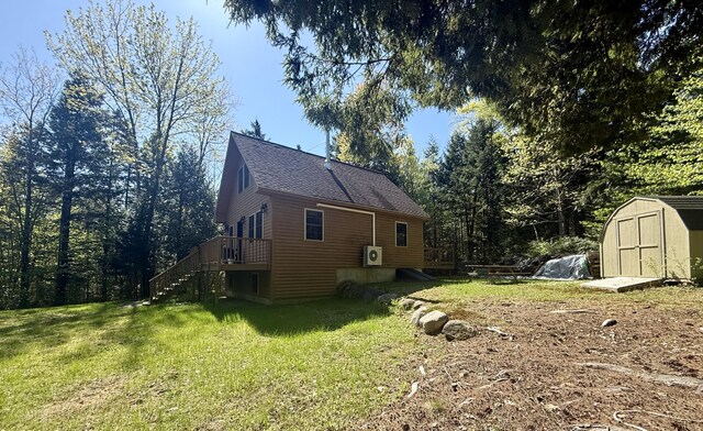 4 Bobs Way, Bethel, ME 04217 - view of side of property with a storage shed, a yard, stairway, a deck, and an outbuilding