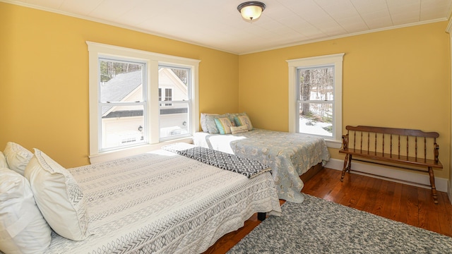 257 S Rumford Rd, Rumford, ME 04276 - bedroom featuring ornamental molding, multiple windows, wood-type flooring, and baseboards