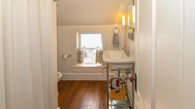 257 S Rumford Rd, Rumford, ME 04276 - full bathroom with a sink, toilet, hardwood / wood-style flooring, baseboards, and a shower with shower curtain