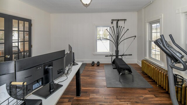 257 S Rumford Rd, Rumford, ME 04276 - workout area with wood finished floors, baseboards, and radiator