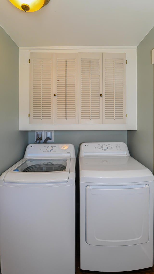 257 S Rumford Rd, Rumford, ME 04276 - clothes washing area featuring cabinet space and independent washer and dryer