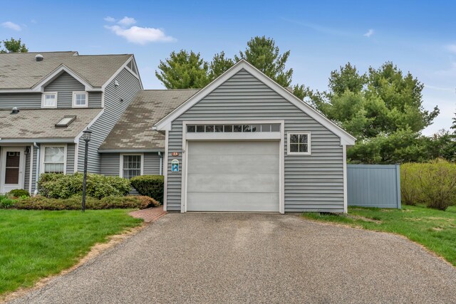 23 Winterberry Ct Unit 23, Cumberland, ME 04021 - traditional-style house featuring a front lawn, aphalt driveway, an attached garage, and fence