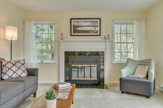 23 Winterberry Ct Unit 23, Cumberland, ME 04021 - sitting room with a wealth of natural light, a fireplace, baseboards, and carpet floors