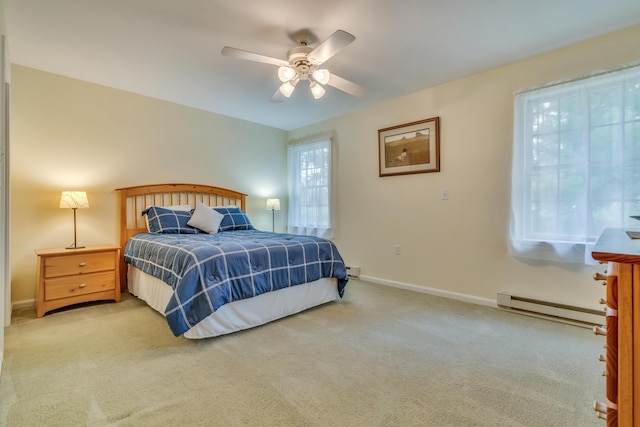 23 Winterberry Ct Unit 23, Cumberland, ME 04021 - bedroom with a baseboard heating unit, carpet flooring, a ceiling fan, and baseboards
