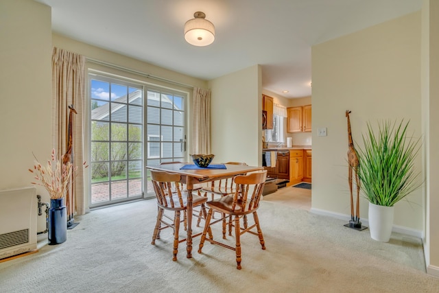 23 Winterberry Ct Unit 23, Cumberland, ME 04021 - dining room with light colored carpet, heating unit, and baseboards